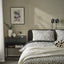 BJÖRKGRÅMAL dotted duvet set on bed