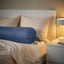 DVALA blue bolster on made bed