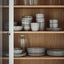 GLADELIG grey stoneware dishes on shelves