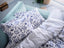 JUNIMAGNOLIA white/dark blue bedding, in a bedroom