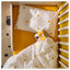 ÖGONLOCKSMAL cot bedlinen set styled on a cot