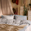 SOLFIBBLA blue stripe bedding on bed