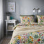 STRANDLUMMER floral duvet on bed in room